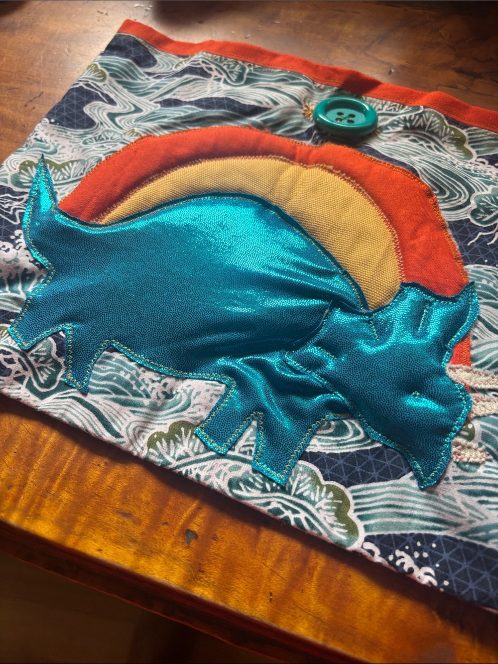 Teal Metallic Dinosaur Appliqué Cloth with Orange & Yellow Sun
